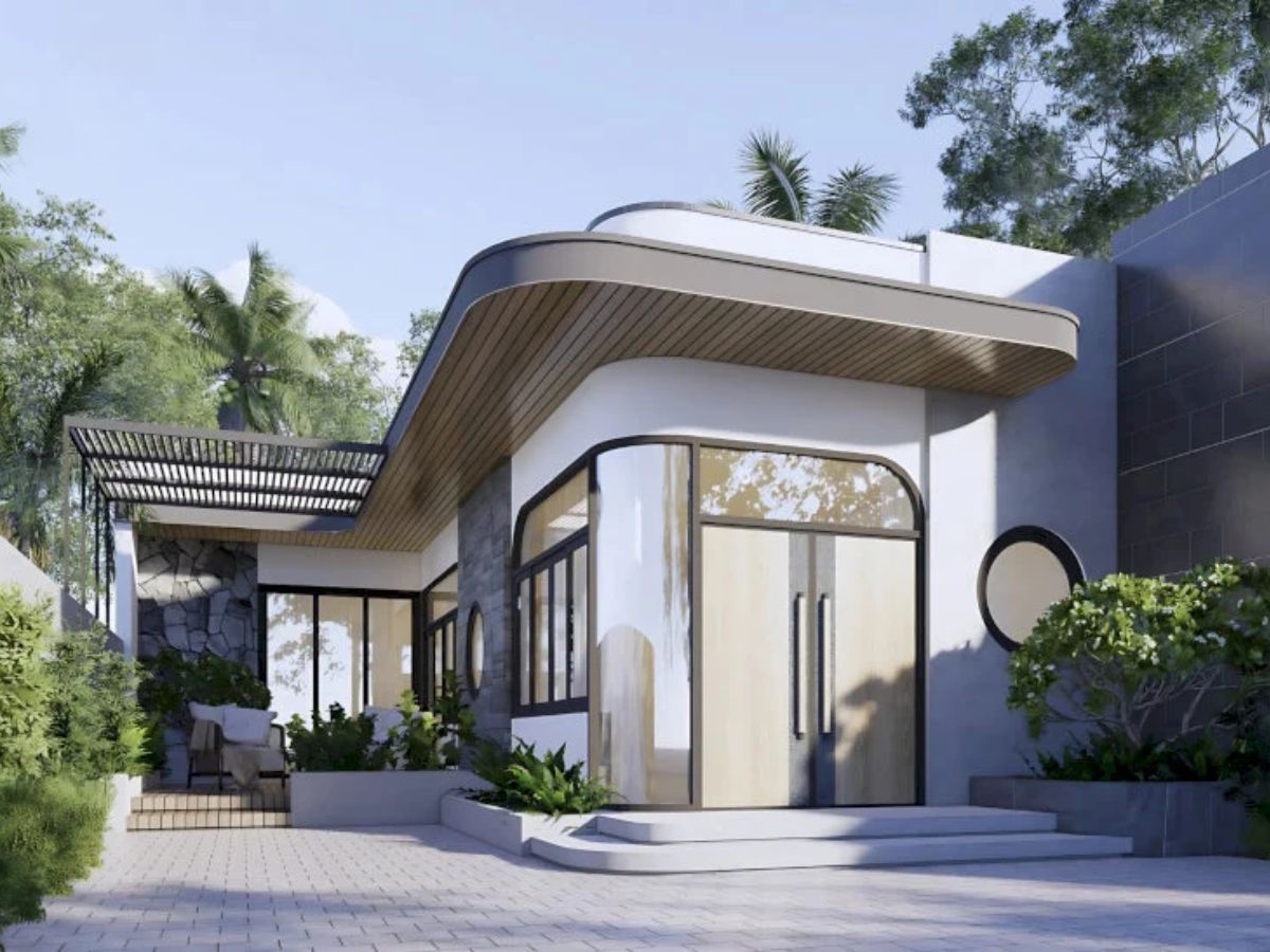 Thiết kế nh&agrave; chữ L 1 tầng m&aacute;i bằng c&oacute; c&aacute;c cửa k&iacute;nh lớn kết nối với kh&ocirc;ng gian b&ecirc;n ngo&agrave;i