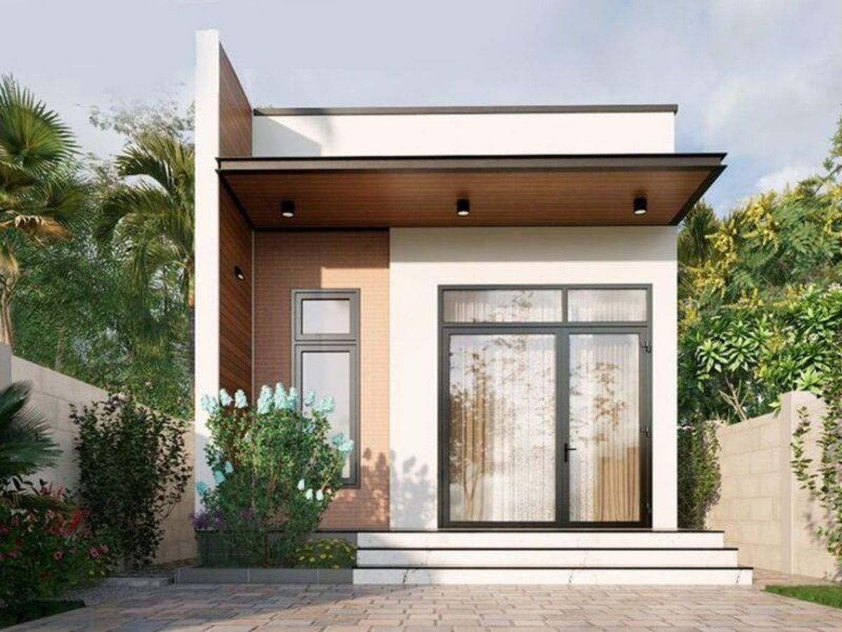 Nh&agrave; ống 1 tầng 5x20 c&oacute; tone trắng chủ đạo với phần gỗ ốp bắt mắt v&agrave; cửa k&iacute;nh lớn hiện đại