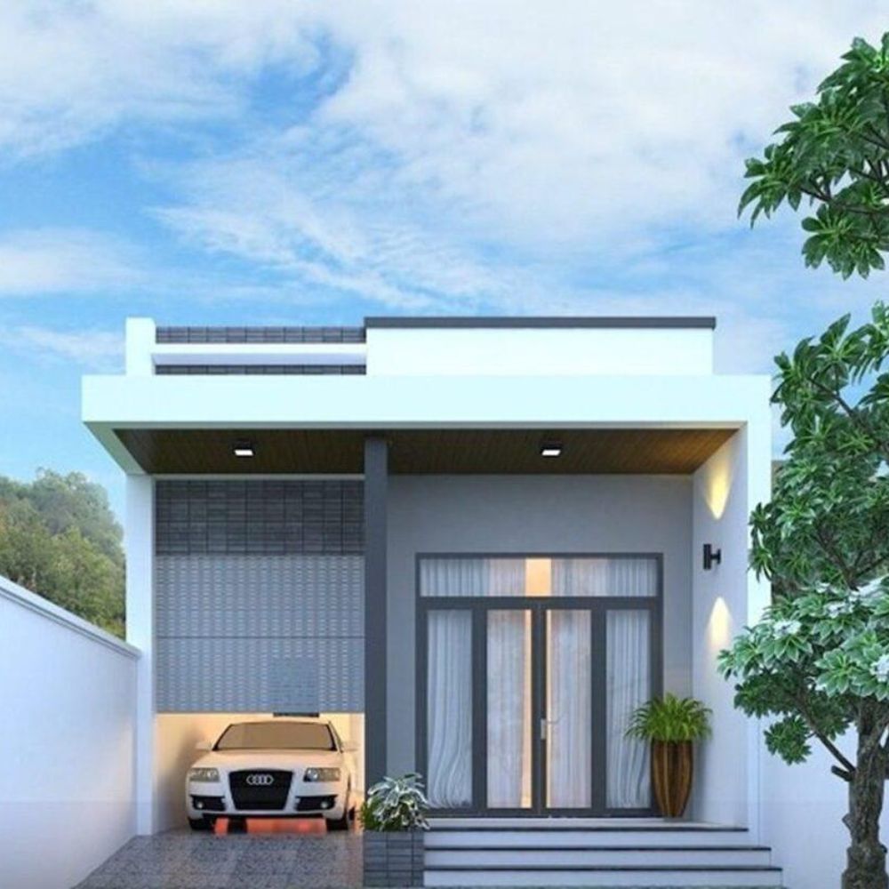 Mặt tiền nh&agrave; cấp 4 t&iacute;ch hợp gara &ocirc; t&ocirc; với hệ cửa cuốn hiện đại